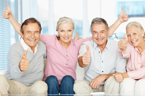 Healthy family giving thumbs up